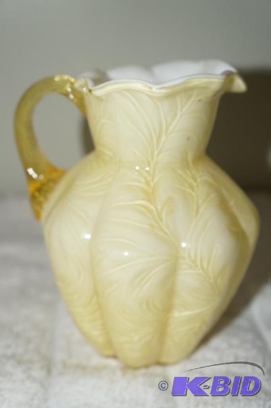 lot 99 image: Fenton Light Yellow Milk Glass Miniature Water Pitcher