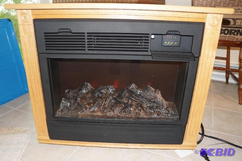 lot 98 image: Heat Surge Electric Fireplace Portable Heater on Wheels