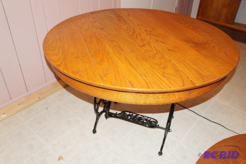 lot 62 image: Vintage Oak Table Top Mounted on Vintage Sewing Machine Metal Frame