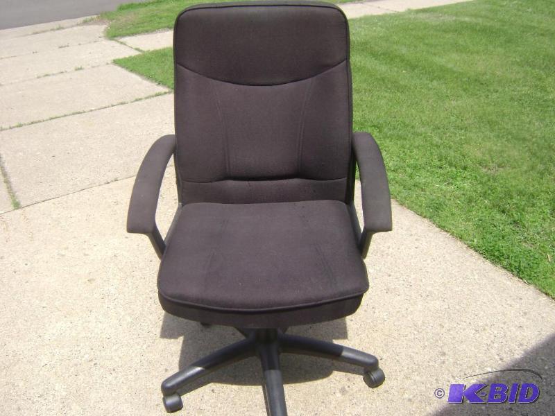 Black cloth office chair has seat adjustment ...