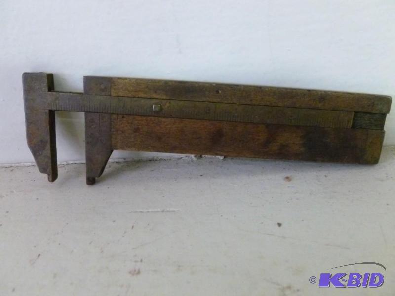 lot 100 image: Vintage brass and wooden bodied cal...