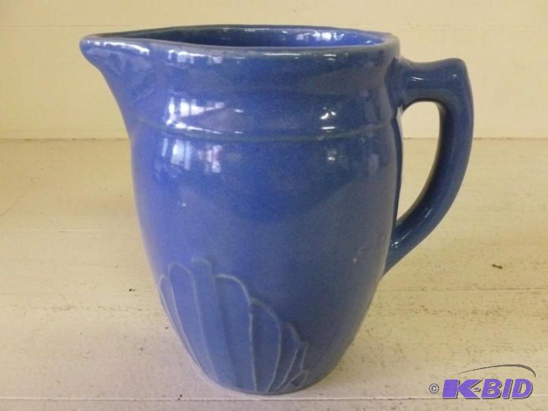 lot 146 image: Vintage Fiesta Type pitcher that me...
