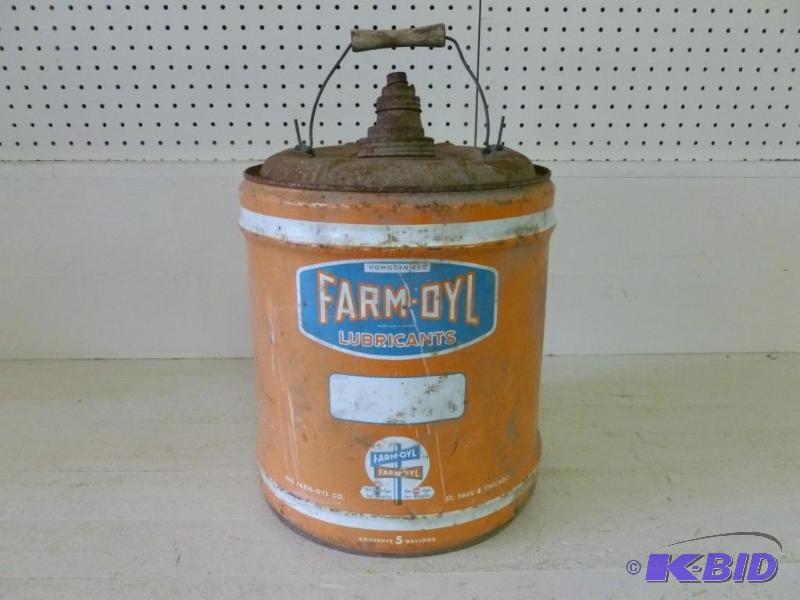 lot 15 image: Vintage Farm-Oyl 5 gallon metal oil...
