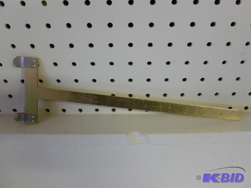 lot 271 image: Potawatomi metal archery ruler that...