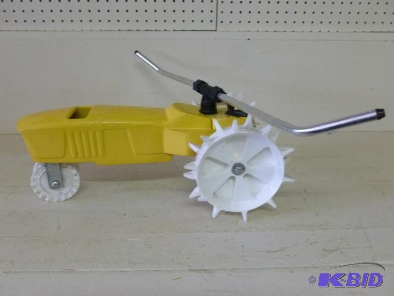 lot 7 image: Large cast metal lawn tractor sprin...