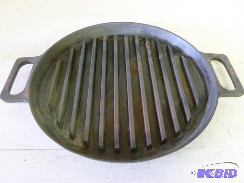 lot 97 image: Large double handled cast iron gril...