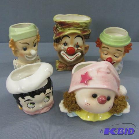 lot 23 image: Five Head Vases
