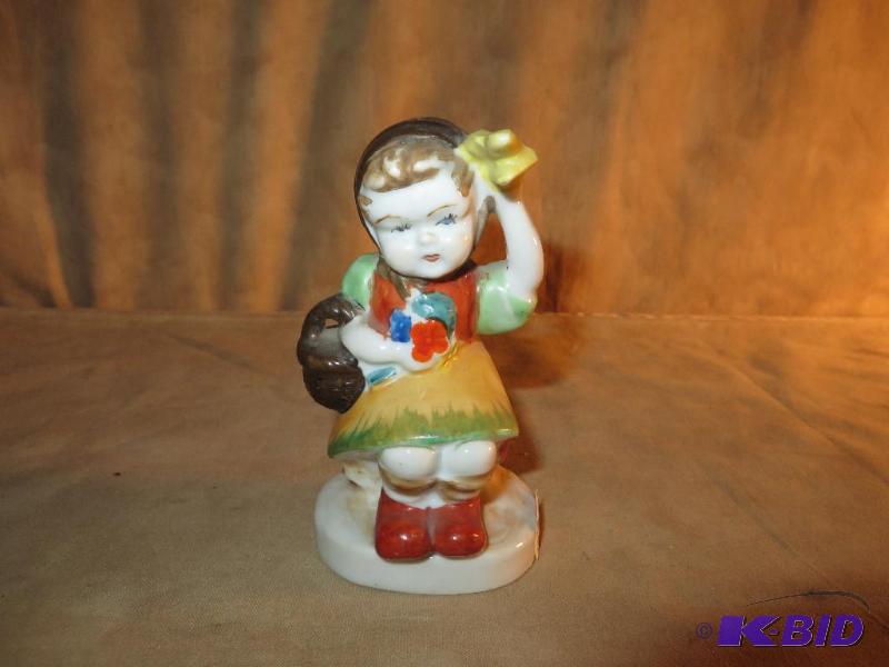 lot 49 image: Little Girl Sitting with Basket and (hanky ) by her head