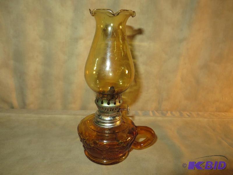 lot 55 image: 7 ALL AMBER OIL LAMP