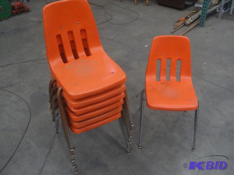 lot 39 image: (7) Stackable Plastic Chairs...