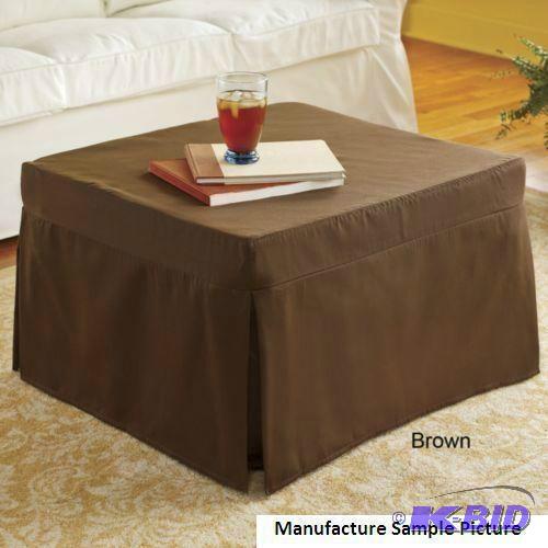 lot 57 image: Folding Ottoman Has Brown Slip Cover As an ot...