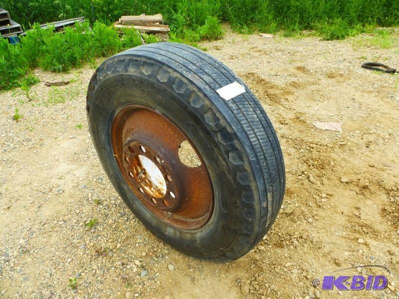lot 19 image: Tire with steel rim 11R 24.5 Front tire tread...