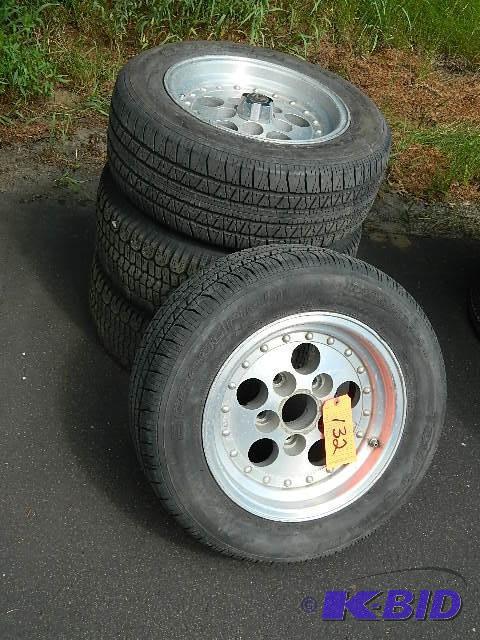 lot 132 image: Lot of (4) Modern 14 x 7 Rims & Tire...