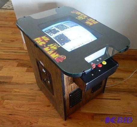 lot 2 image: Miss Pac-Man Cocktail Table video game consol...
