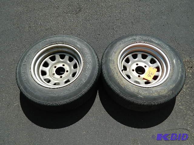 lot 36 image: Pair of 15" Rims w Uniroyal P20575R15 ...
