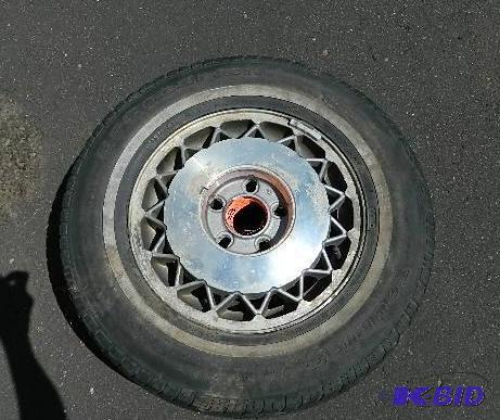 lot 38 image: (1) BF Goodrich P21570R15 on rim. Approx. 35...
