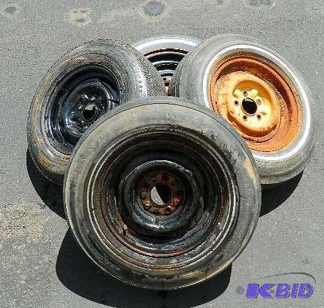lot 40 image: (3) 14" rims, (1) 15" rim, all with...