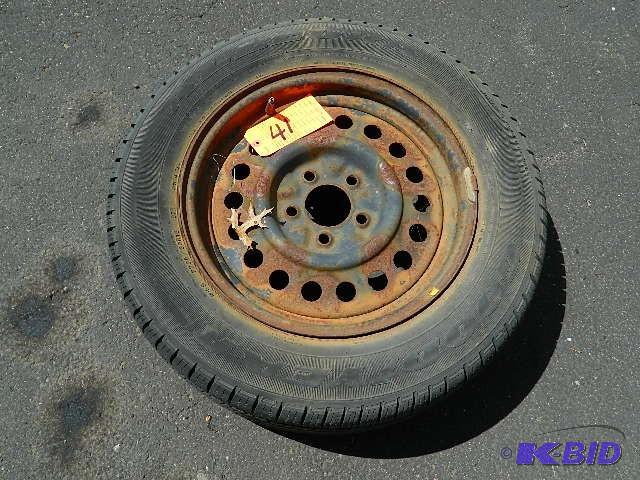 lot 41 image: (1) P22560R16 tire w rim. 5 bolt pattern. A...