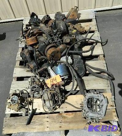 lot 44 image: Power Steering pumps and 4 carburetors for mi...