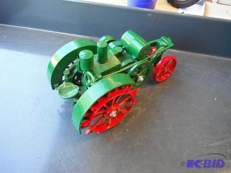 lot 115 image: Green and Red Mogul Toy Tractor...