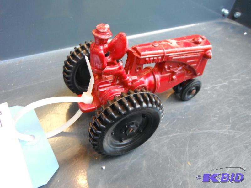 lot 28 image: Vintage Red Toy Tractor with Driver...