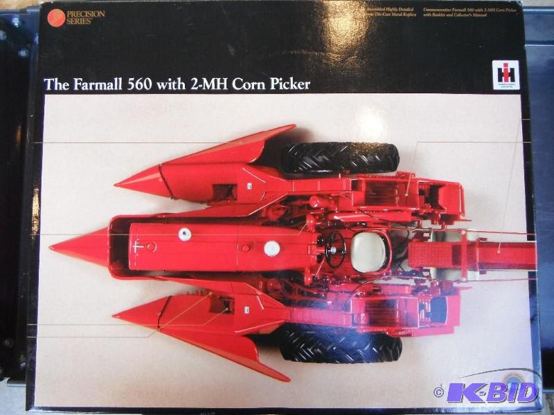 lot 32 image: IH Farmall 560 with 2-MH Picker Tractor Preci...