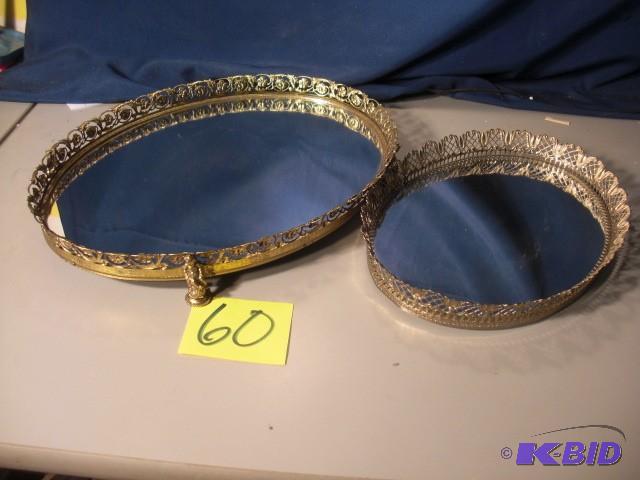 2, oval shaped gold coloredMirrored Trays.  ...