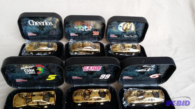 6 Gold tone die cast cars in cases including...