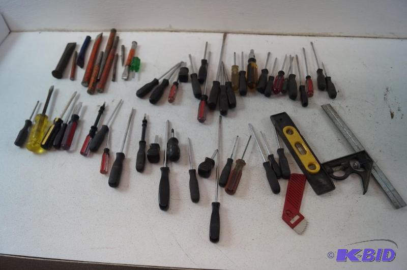 Assortment of screwdrivers and level