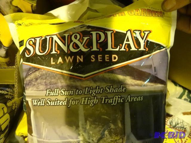 lot 142 image: Approx 30 lbs lawn seed...