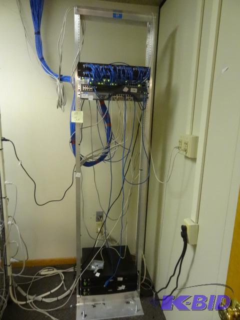lot 13 image: Aluminum network rack. Mounted to floor. Brin...