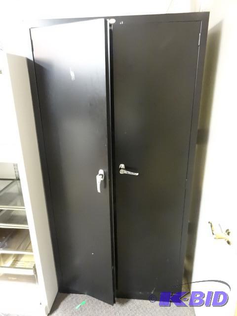Metal 2 door cabinet. 4 shelves with lock and...