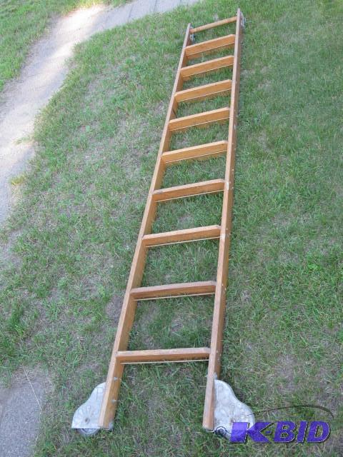 Library ladder, tracks on top, sideways point...