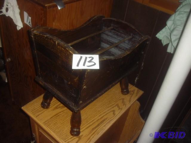 Looks like a childs doll cradle, but is actu...