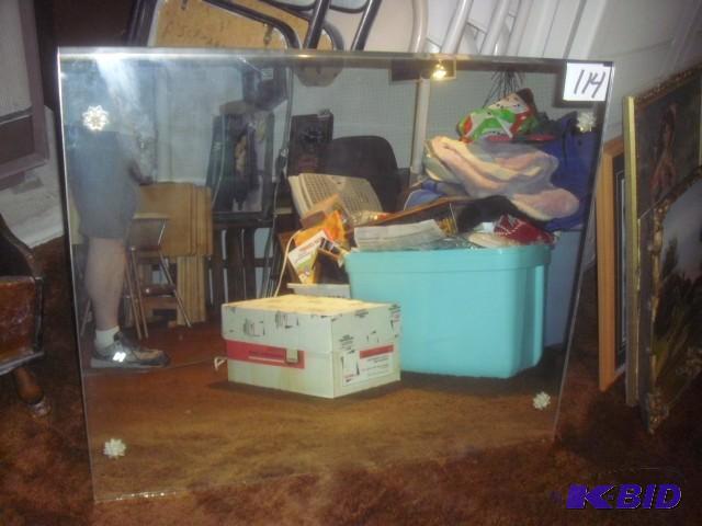 Mirror, bevel edge on top and bottom. Has pla...
