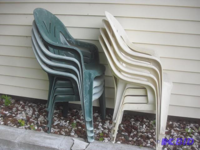 8 Plastic outdoor chairs.. Faded and need cle...