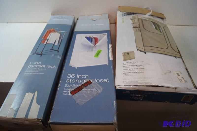 two portable closets and a clothes rack