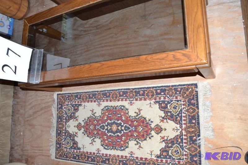 lot 27 image: Coffee table and rug