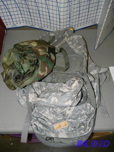 lot 137 image: Military issue camo backpack and smaller bag...