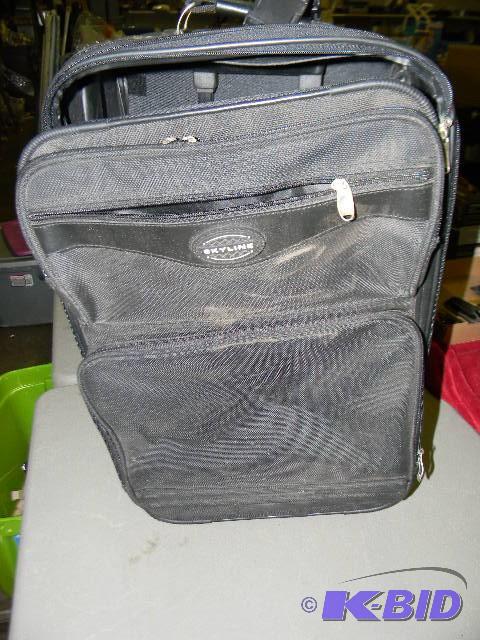 lot 186 image: Black rolling luggage...