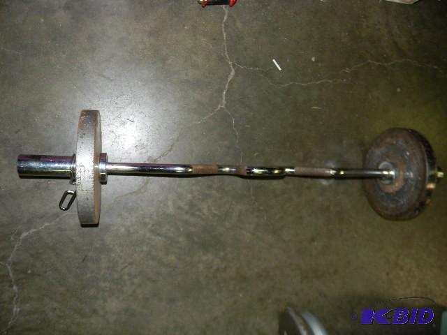 lot 187 image: Curl bar with two 25lb. weights...
