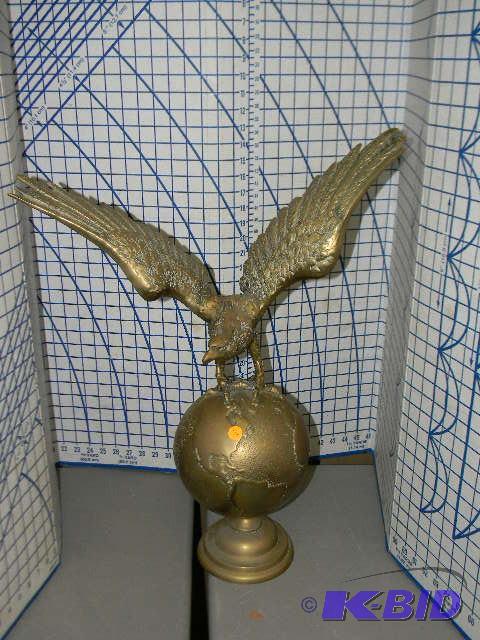 lot 2 image: Brass statue of an eagle on top of the world ...