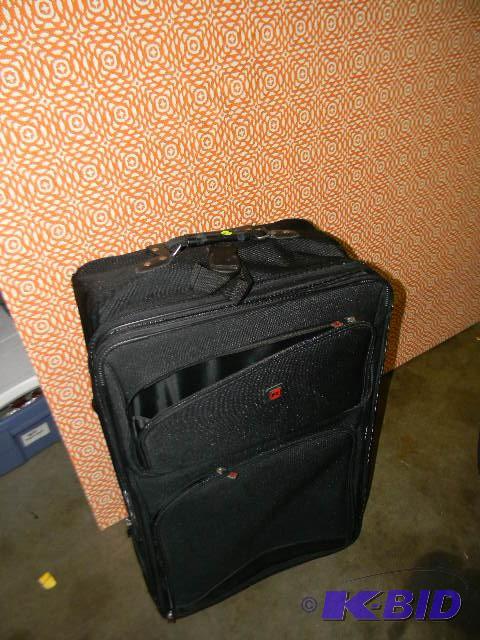 lot 227 image: Black rolling luggage...