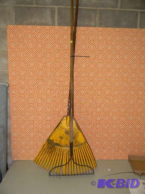 lot 275 image: Lot of 2 rakes - one plastic and one metal...