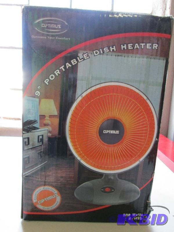 lot 21 image: Optimus 9 inch portable dish heater. Customer...