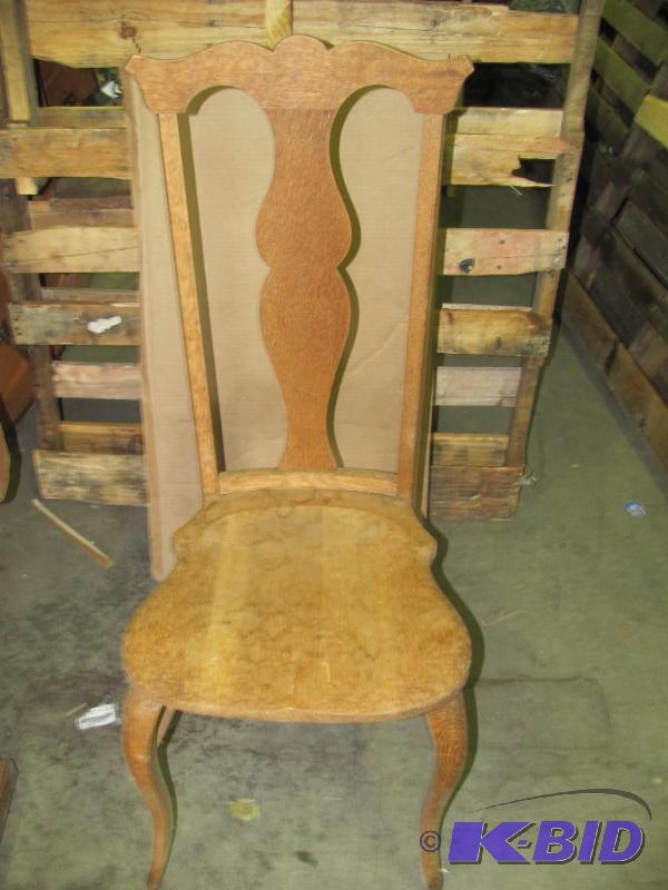 This Vintage Wooden Side Chair features a hig...