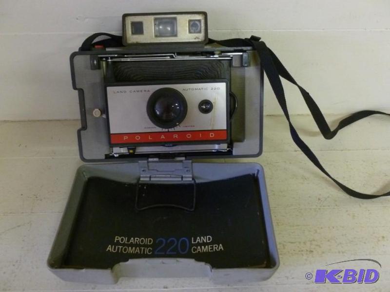 lot 135 image: Vintage Polaroid 220 camera....