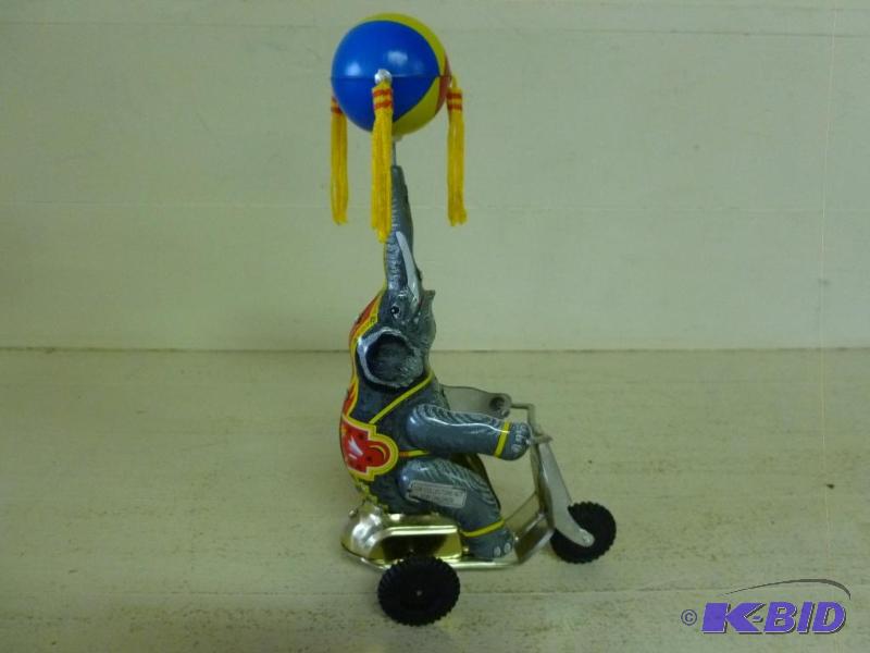 lot 195 image: Collectible wind up tin elephant on motorcycl...