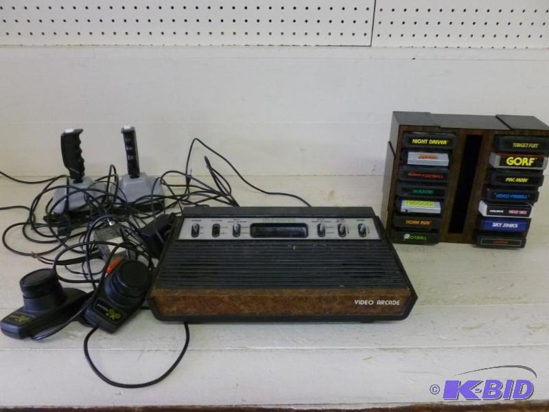 lot 6 image: Collectible Atari game console, comes with tw...