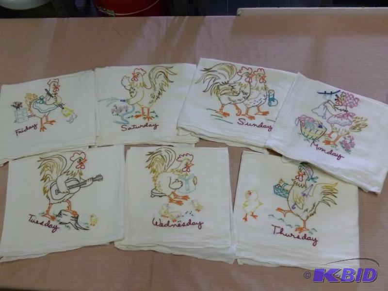 lot 65 image: A set of seven day embroidered kitchen towels...